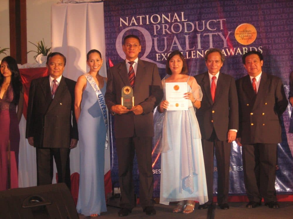 Eaglewatch team receiving the National Product Quality Excellence Award on stage, 2006